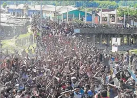  ?? AFP ?? Rohingya refugees shout slogans at a protest against the repatriati­on programme at the Unchiprang refugee camp near Teknaf in Bangladesh on Thursday.