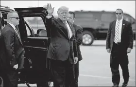  ?? AP/EVAN VUCCI ?? President Donald Trump waves as he arrives Monday to board Air Force One at Palm Beach Internatio­nal Airport in West Palm Beach, Fla., to return to Washington.