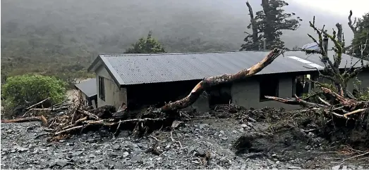  ?? STUFF ?? The Lake Howden Hut was surrounded by green foliage before a landslide with trees, mud and rocks slammed into it during a storm in February.