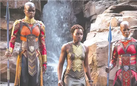  ??  ?? A scene from Marvel Studios’ “Black Panther” whivh features our very own Danai Gurira (left)