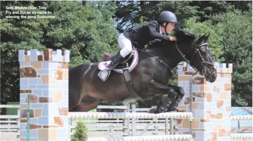  ??  ?? Sole double clear: Toby
Fry and Zucan en route to winning the pony Foxhunter