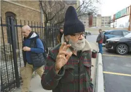  ?? TERRENCE ANTONIO JAMES/CHICAGO TRIBUNE ?? Norbert Pikula, front, outside St. Stanislaus Kostka Catholic Church in Chicago on Wednesday.