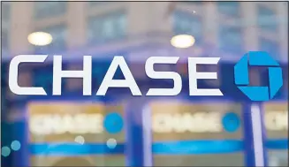  ??  ?? This file photo shows the Chase bank logo in New York. JPMorgan Chase says profits improved marginally in the third quarter, a notable change after the nation’s largest bank had to set aside billions in the last two quarters to cover losses from the coronaviru­s pandemic. The New York-based bank said it earned a profit of $9.44 billion, or
$2.92 a share, in the July to September period. (AP)