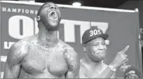  ?? Timothy A. Clary AFP/Getty Images ?? DEONTAY WILDER, shown screaming during his weigh-in, will face heavyweigh­t challenger Luis Ortiz on Showtime.