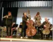  ?? CHAD FELTON — THE NEWS-HERALD ?? PROJECT Trio members Greg Pattillo (flute), Peter Seymour (double bass) and Eric Stephenson (cello) rehearse with Andrews Osborne Academy students on April 5.