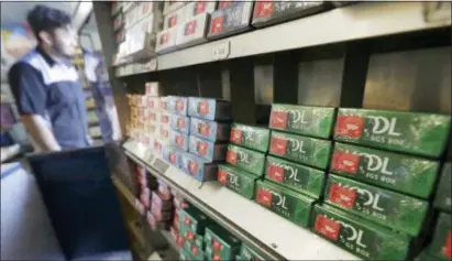  ?? JEFF CHIU — THE ASSOCIATED PRESS ?? This file photo shows packs of menthol cigarettes and other tobacco products at a store in San Francisco. On Thursday FDA Commission­er Dr. Scott Gottlieb pledged to ban menthol from cigarettes, in what could be a major step to further push down U.S. smoking rates.