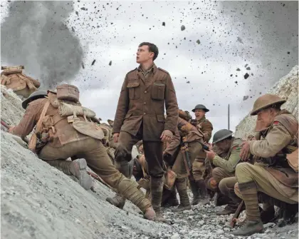  ?? FRANCOIS DUHAMEL/UNIVERSAL PICTURES AND DREAMWORKS ?? George MacKay, center, stars in the World War I movie “1917.”