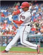 ?? BRAD MILLS/USA TODAY SPORTS ?? Nationals left fielder Juan Soto hits a three-run home run in his first career at-bat.