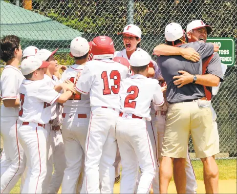  ?? Christian Abraham / Hearst Connecticu­t Media ?? Fairfield American celebrates its 12- 2 victory over Trumbull National in the District 2 Little League championsh­ip game at Unity Park in Trumbull on Saturday.