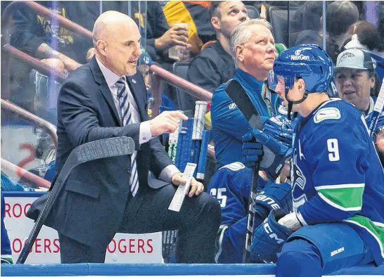  ?? USA TODAY SPORTS ?? Vancouver Canucks’ head coach Rick Tocchet instructs forward J.T. Miller during an NHL game.