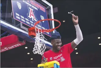  ??  ?? RIGHT: Deandre Ayton cuts the net after Arizona won the Pac 12 Conference Championsh­ip on March 3 in Tucson, Ariz.