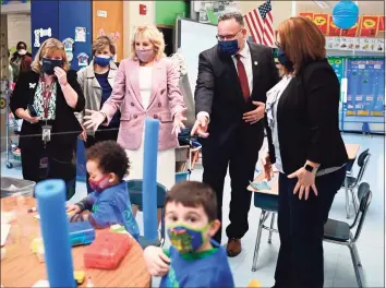  ?? Mandel Ngan / Pool / AFP via Getty Images ?? First lady Jill Biden and Education Secretary Miguel Cardona tour Benjamin Franklin Elementary School in Meriden on Wednesday.