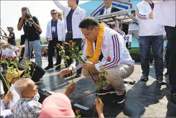  ?? Madaree Tohlala ?? PALANG PRACHARAT party leader Uttama Savanayana, center, said that only his party’s candidate could ensure Thailand’s stability. “How many people can you think of who can lead the country to peace?” he said.