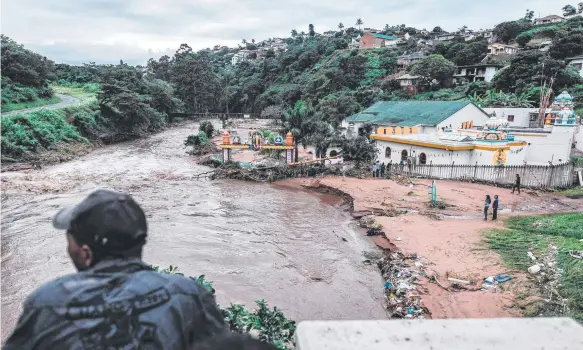  ?? Picture: AFP ?? The Umhlatuzan­a Hindu Temple, south of Durban, damaged after the South African township was hit by heavy rain and flash floods