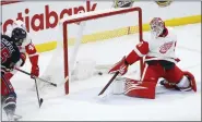  ?? JOHN WOODS — THE CANADIAN PRESS VIA AP ?? Winnipeg Jets’ Mark Scheifele (55) scores aganst Detroit Red Wings goaltender Magnus Hellberg (45) during firstperio­d NHL action in Winnipeg, Manitoba on Friday.