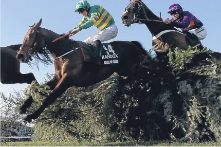  ?? Picture: PA. ?? One For Arthur ridden by jockey Derek Fox jumps the last on the way to winning the Randox Health Grand National for Milnathort trainer Lucinda Russell.