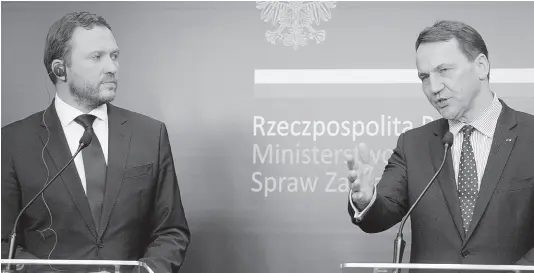  ?? AP ?? Poland’s Foreign Minister Radek Sikorski (right), and Estonia’s Foreign Minister Margus Tsahkna address reporters following their talks on regional security and continuing support for Ukraine in its struggle against Russia’s invasion, at the Foreign Ministry in Warsaw, Poland, yesterday.