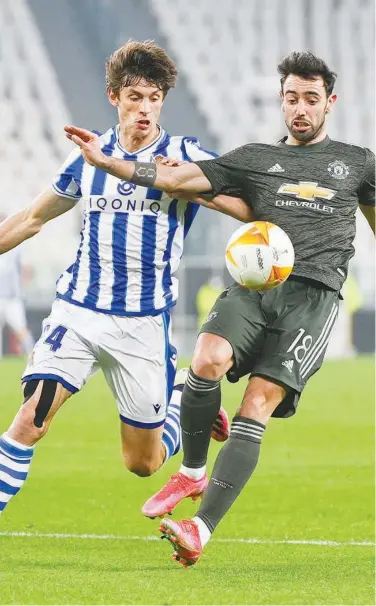  ?? Associated Press ?? Real Sociedad’s Robin Le Normand (left) vies for the ball with Manchester United’s Bruno Fernandes during their Europa League, round of 32, first-leg match on Thursday.