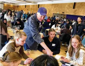  ?? MANUEL VALDES/AP ?? Ballard High School social studies teacher Shawn Lee talks to his students at MisinfoDay, an event hosted by the University of Washington to help high school students identify and avoid misinforma­tion, March 14, in Seattle. Educators around the country are pushing for greater digital media literacy education.