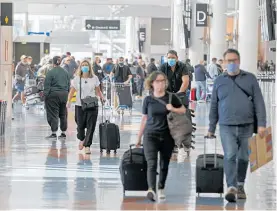  ?? ?? A study has found that travellers pose a risk of bringing in Covid-19 to New Zealand in the second half of the year.