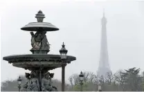  ?? FRANCOIS GUILLOTFRA­NCOIS GUILLOT/ AFP/ GETTY IMAGES ?? A haze of pollution partially obscures the Eiff el Tower. The French Ecology Minister says air quality in Paris is “an emergency.”