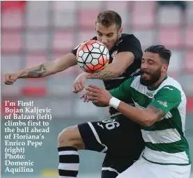  ??  ?? I’m First! Bojan Kaljevic of Balzan (left) climbs first to the ball ahead of Floriana’s Enrico Pepe (right) Photo: Domenic Aquilina