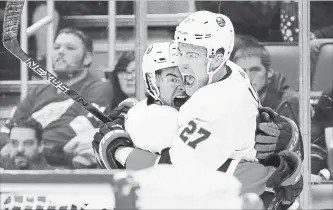  ?? ASSOCIATED PRESS FILE PHOTO ?? New York Islanders left-winger Anders Lee (27) celebrates his goal against the Red Wings with Mathew Barzal in the third period of a National Hockey League game on April 7 in Detroit.