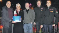  ??  ?? Andrew Spence (BID4Oban), left, at the switch-on with Elaine Robertson (OCGF), Drew Kirkland (ARK Production Consultanc­y), Colin MacNivan and Christine Roberts (MacNivan Electrics).