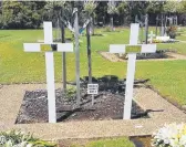  ??  ?? The grave sites of Dreamworld tragedy victims Kate Goodchild and Luke Dorsett.