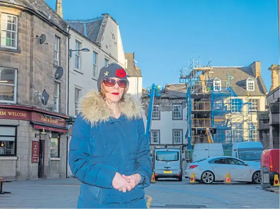  ?? Pictures: Steve MacDougall. ?? Caroline Macdonald with her flat in the background on St John Street, Perth.