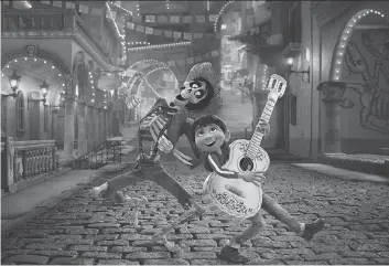  ?? DISNEY-PIXAR VIA THE ASSOCIATED PRESS ?? Characters Hector and Miguel have some fun in a scene from the new animated movie Coco. Byron Bashforth of Okla, Sask., is the film’s “character shading lead”.