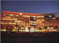  ??  ?? The MoPH building illuminate­d in orange in recognitio­n of the efforts made by health workers.
