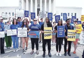  ?? PAUL MORIGI/GETTY IMAGES FOR WE THE 45 MILLION ?? Protesters rally on June 30 outside the Supreme Court, which struck down President Joe Biden’s plan to wipe out student loan debt.