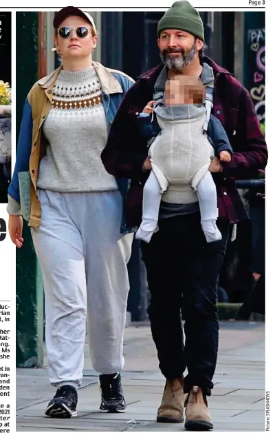  ?? ?? Family stroll: Ms Snook with husband Dave Lawson and their baby in London