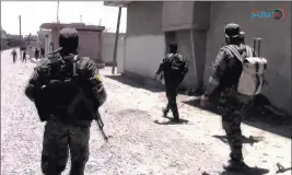  ??  ?? The Associated Press This frame grab from video released Friday shows U.s.-backed Syrian Democratic Forces fighters advancing in Raqqa, Syria.