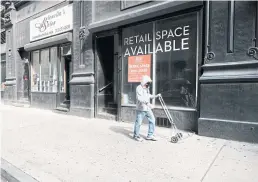  ?? AFP ?? A store in New York City sits empty as the pandemic batters the economy, causing inflation to surge amid Covid-induced supply chain disruption­s.