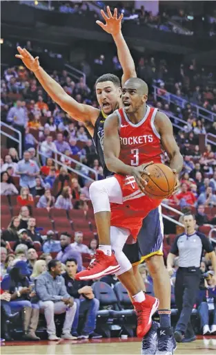  ?? THE ASSOCIATED PRESS FILE ?? Houston Rockets guard Chris Paul drives to the basket in front of Golden State Warriors guard Klay Thompson during a game in Houston in January. The teams have developed a strong rivalry.