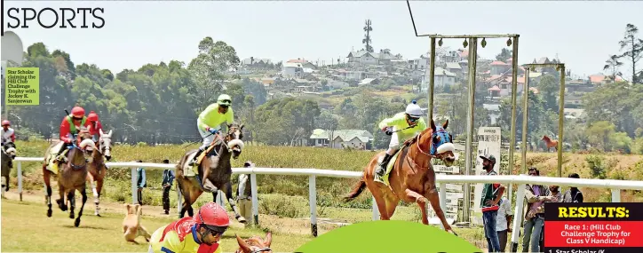  ??  ?? Star Scholar claiming the Hill Club Challenge Trophy with Jockey K. Sanjeewan