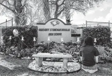  ?? Saul Martinez / New York Times ?? Students at Marjory Stoneman Douglas High School in Parkland, Fla., observed a day of mourning for the 17 lives lost in the nation’s deadliest school shooting on Feb. 14, 2018.