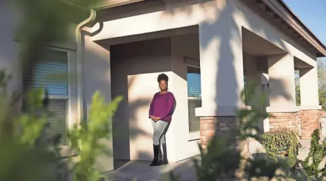  ?? MICHAEL CHOW/THE REPUBLIC ?? Sha Wanda Brewer stands outside her new house in Phoenix in February 2018. With mortgage applicatio­ns low for African Americans and rejection rates high, the 39-year-old received help from a housing nonprofit to buy her first home.
