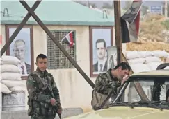  ??  ?? 0 Syrian government troops at the Wafideen checkpoint