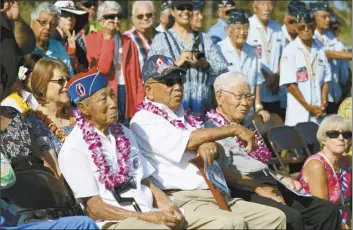  ?? The Maui News / COLLEEN UECHI photo ?? Hiroshi Arisumi (from left) sits alongside fellow World War II veterans George Sano and Seiya Ohata as they listen during the dedication ceremony for the World War II memorial at the Maui Veterans Cemetery in Makawao on May 29, 2017.