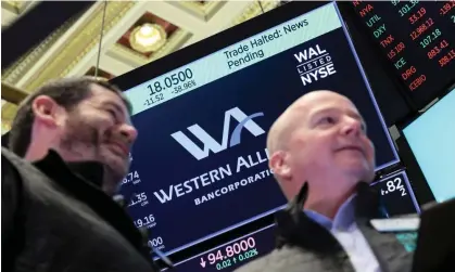  ?? Photograph: Brendan McDermid/Reuters ?? A screen displays that trading is halted for Western Alliance on the floor of the New York Stock Exchange.