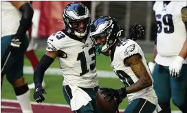  ?? RICK SCUTERI - THE ASSOCIATED PRESS ?? Eagles wide receiver Travis Fulgham, left, and Quez Watkins celebrate the latter’s touchdown during last Sunday’s game in Arizona. The Eagles travel to Dallas this week with their playoff hopes alive, if only barely.