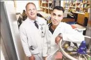  ?? Arnold Gold / Hearst Connecticu­t Media ?? Dr. Jon Koff, left, and researcher Ben Chan, who work with phages, at Yale Medical School in New Haven.