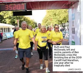  ?? JAMES DAVIES ?? Ruth and Paul McDonald, left and centre, parents of Ben McDonald, cross the finishing line at the 2019 Cardiff Half Marathon, one year after he tragically died