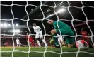  ?? Photograph: Phil Noble/Reuters ?? Lukasz Fabianski lets Mohamed Salah’s shot slip through his hands for Liverpool’s equaliser.