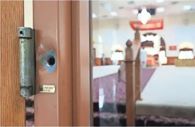  ?? MICHAEL SEARS / MILWAUKEE JOURNAL SENTINEL ?? A bullet hole left from the Aug. 5, 2012, attack on the Sikh Temple of Wisconsin in Oak Creek remains on a door frame to the main hall. Beneath the hole is a small brass plate inscribed, “We Are One,” with the date, 8-5-12. See more photos at...