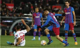  ?? Photograph: Joan Monfort/AP ?? Pedri wrong-foots Diego Carlos before scoring the breakthrou­gh goal for Barcelona.