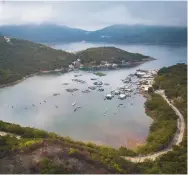  ??  ?? Left: the fishing village of Po Toi
O on Clear Water Bay Peninsula is renowned for its seafood.
Below: aerial view of Tai O stilted village on Lantau island